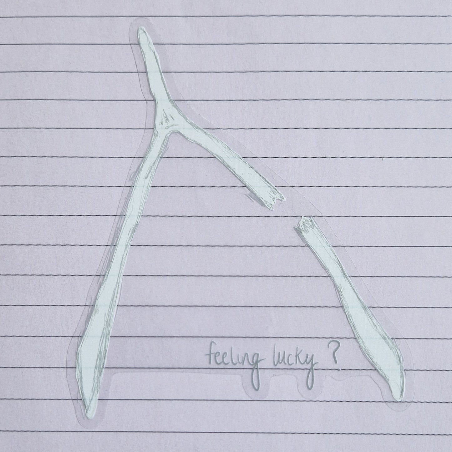 Broken wishbone sticker with the words 'feeling lucky?' written across the bottom. The sticker has a transparent background and is on a lined lilac paper.