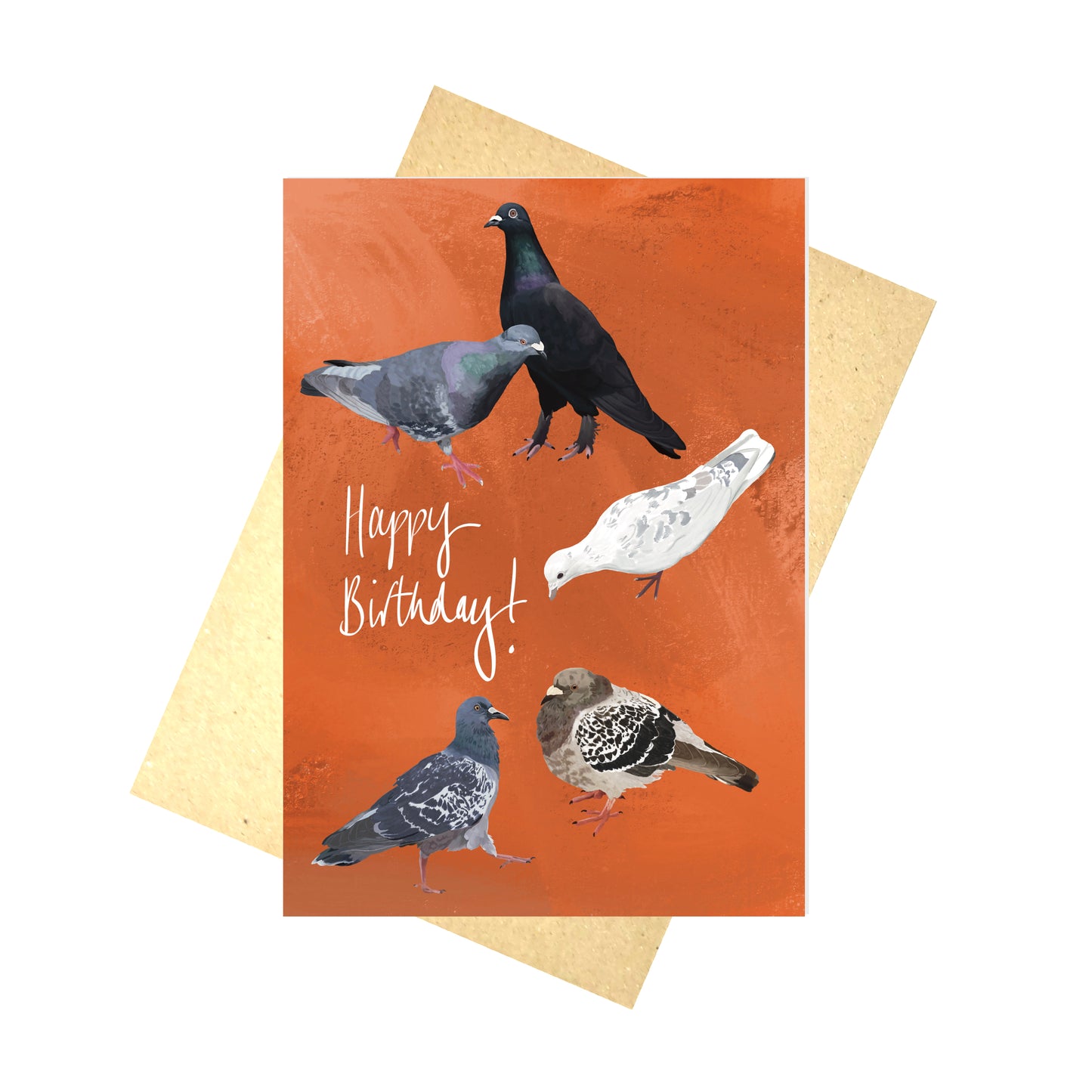 A bright orange greetings card with five different pigeons and the words 'Happy Birthday!' in white handwriting. Behind the card is a brown paper envelope, behind which is a white background.