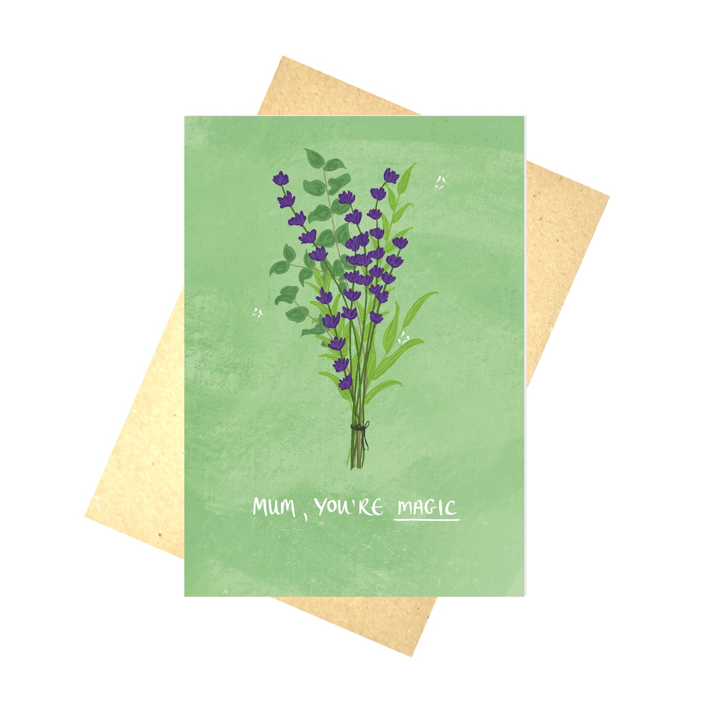 A green card featuring a  bunch of purple lavender and green eucalyptus and leafy vines with the words 'MUM, YOU'RE MAGIC' in white handwriting. Behind the card is a brown paper envelope, behind which is a white background.