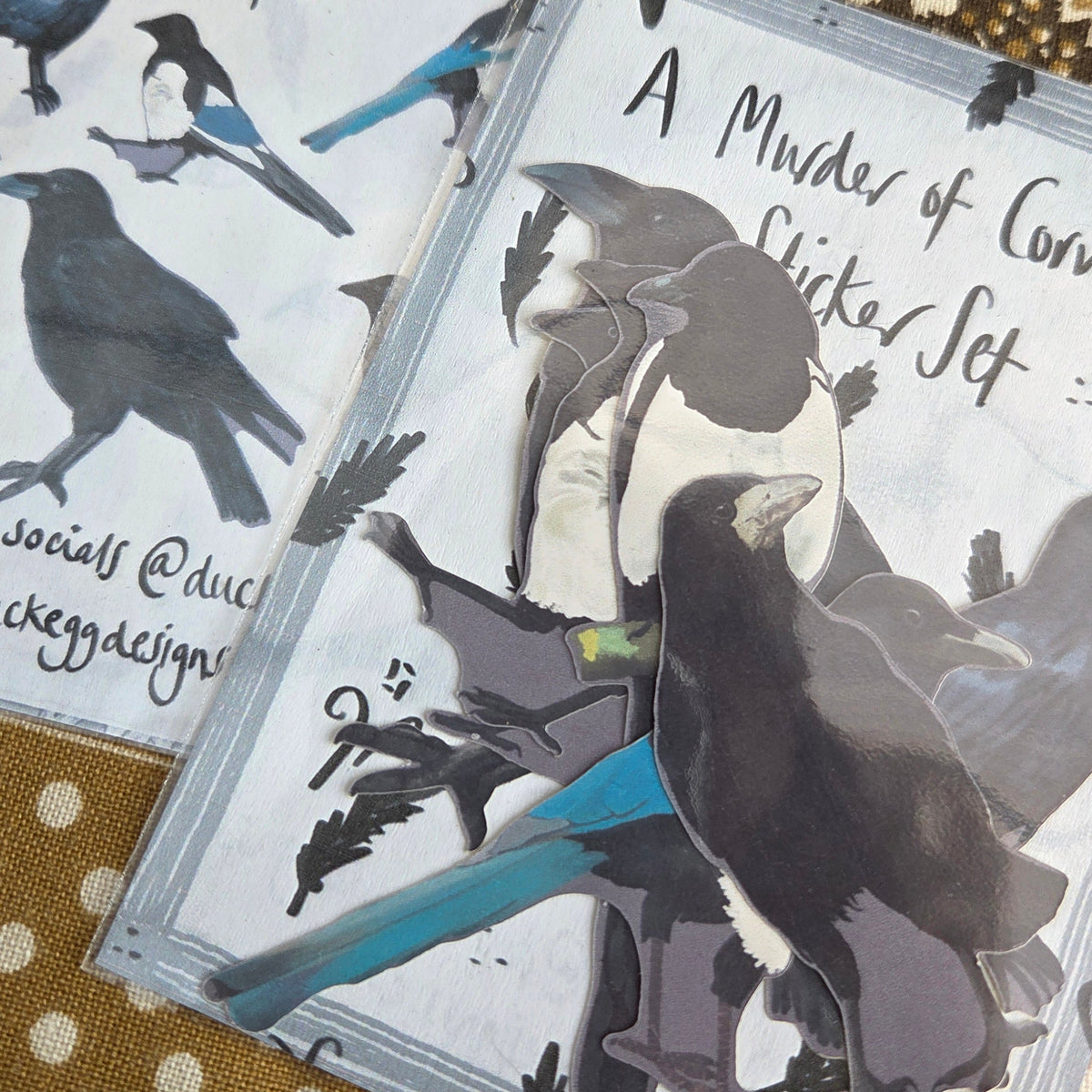 A close up of two sticker sets next to each other showing the detail in the sticker designs.