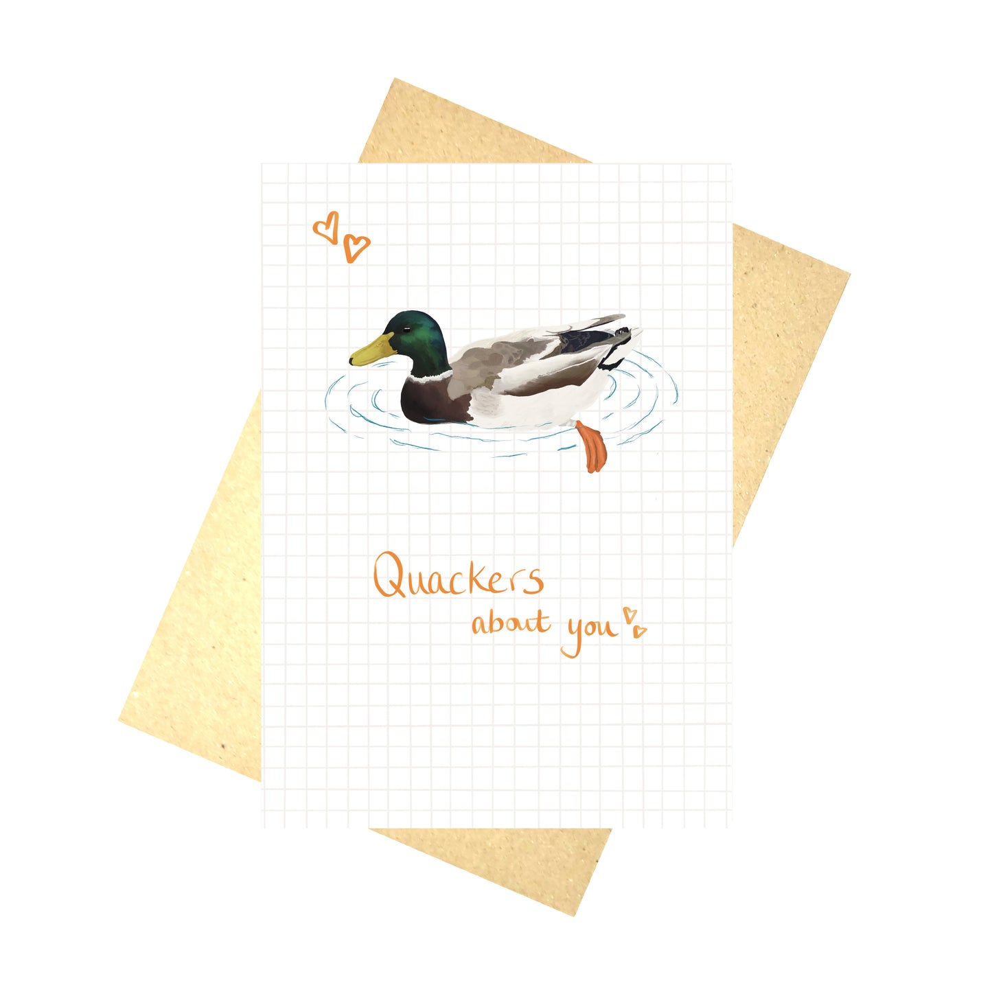 A white card with a grey grid pattern on it and a male mallard duck illustration on some blue water. Above the duck are two orange hearts and words underneath the duck say 'Quackers about you' in orange handwriting. Behind the card is a brown envelope and a white background.